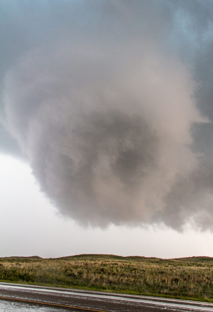 The next wall cloud forms behind us as we're watching the Canadian tornado rope out