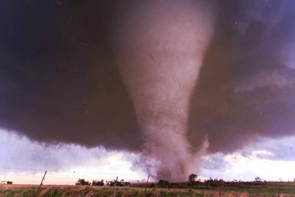 Tornado near Wynnewood croses M3210 road spewing debris into the air